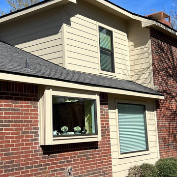 Primed James Hardie Siding in Universal Khaki.