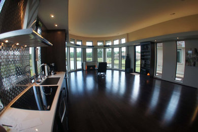 Example of a minimalist family room design in Other