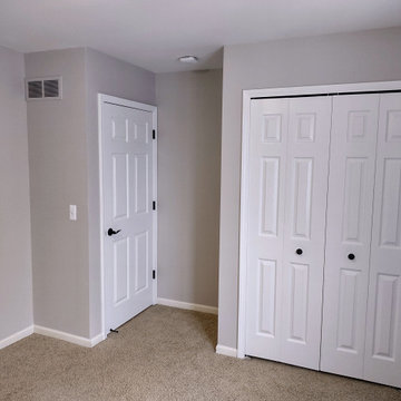 Interior Guest Bedroom, Bedroom Closet and a Stairway Railing