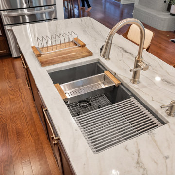 Top-down perspective of a luxury marble island and detailed sink area