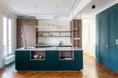 Large mid-century modern galley cement tile floor and green floor open concept kitchen photo in Paris with a single-bowl sink, beaded inset cabinets, green cabinets, marble countertops, beige backsplash, marble backsplash, paneled appliances, an island and beige countertops