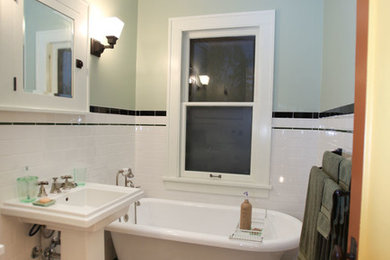Inspiration for a craftsman white tile and ceramic tile claw-foot bathtub remodel in Minneapolis with a pedestal sink, shaker cabinets, white cabinets and a two-piece toilet