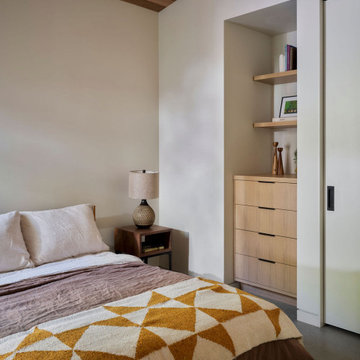 Contemporary ADU Bedroom with Cedar Ceiling and Built-In Oak Storage