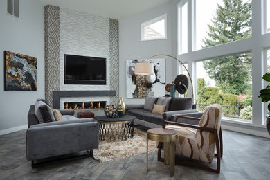 Photo of a mid-sized midcentury formal open concept living room in Portland with grey walls, ceramic floors, a ribbon fireplace, a tile fireplace surround, a wall-mounted tv and grey floor.