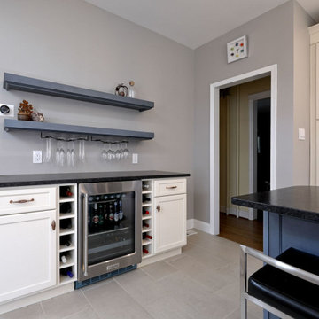 White Kitchen Remodel with Blue Island and Copper Accents