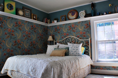 Example of a small eclectic guest dark wood floor bedroom design in Grand Rapids with multicolored walls and no fireplace
