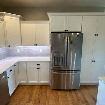 Fresh & Bright: Cabinet Refacing in Satin White with Quartz Upgrade
