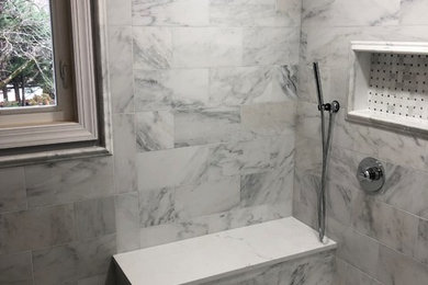 Photo of a mid-sized modern master bathroom in Other with recessed-panel cabinets, dark wood cabinets, a double shower, a one-piece toilet, white tile, marble, grey walls, mosaic tile floors, an undermount sink, quartzite benchtops, white floor, a hinged shower door and white benchtops.