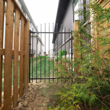 Metal Gate and Wooden Board on Board Fence