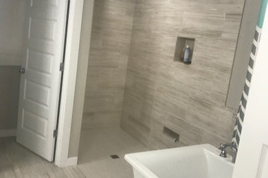 Example of a mid-sized trendy master double-sink bathroom design in Portland with shaker cabinets, white cabinets, an undermount sink, a niche and a built-in vanity