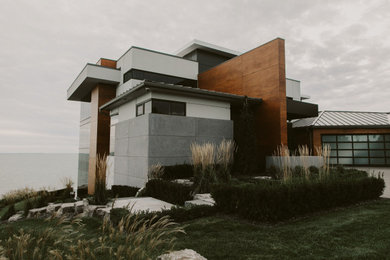 Example of a minimalist concrete exterior home design in Toronto