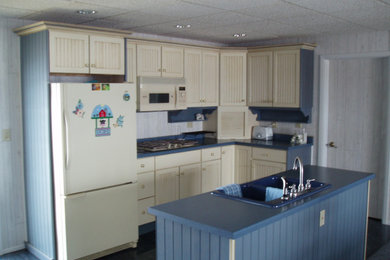 Eat-in kitchen - mid-sized l-shaped ceramic tile and blue floor eat-in kitchen idea in Other with a double-bowl sink, louvered cabinets, beige cabinets, laminate countertops, white appliances, an island and blue countertops
