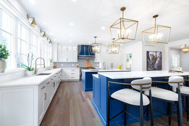 Example of a transitional kitchen design in Boston with two islands