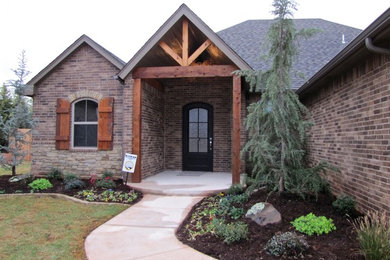 Inspiration for a transitional brown exterior in Oklahoma City with a gable roof.