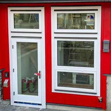 JH Aspyre Collection T&G V-Groove vertical siding in Heritage Red + JH Smooth Tr