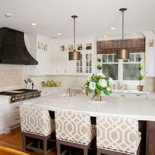 white kitchen  cabinets with almond backsplash beige countertops subway