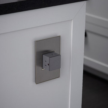 adorne® Pop-Out Outlet - 1-Gang Frame in Magnesium installed in Kitchen.