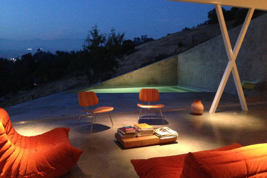 Living room - small modern formal and open concept concrete floor living room idea in Los Angeles with no tv