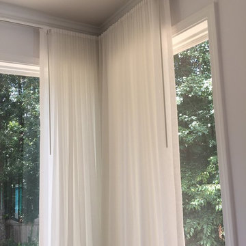 Ripplefold Sheer Drapery Panels stacked in corner