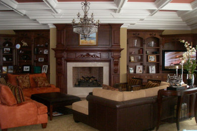 Example of a large classic enclosed medium tone wood floor and brown floor living room design in New York with orange walls
