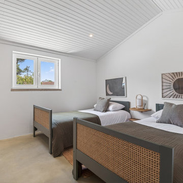 Twin Bedroom with Cane Beds and Graphic Art
