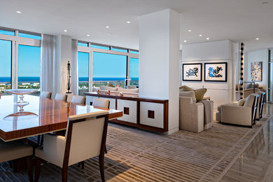 Photo of a mid-sized contemporary open plan dining in Miami with white walls, no fireplace and brown floor.