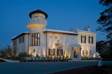 Huge mediterranean white two-story stucco gable roof idea in Miami