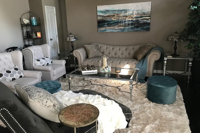 Inspiration for a small coastal open concept medium tone wood floor and brown floor living room remodel in Detroit with beige walls, a standard fireplace and a wall-mounted tv