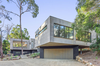 Photo of an expansive contemporary two-storey house exterior in Melbourne.