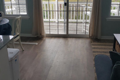 Beach style living room photo in Other
