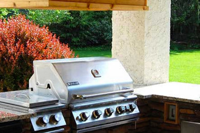 Example of a mid-sized backyard patio kitchen design in Philadelphia