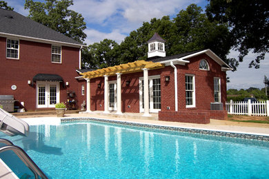Pool - mid-sized traditional indoor rectangular pool idea in Other