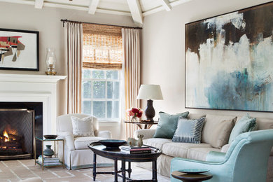 Example of a transitional open concept medium tone wood floor and brown floor living room design in Los Angeles with beige walls, a standard fireplace and a wood fireplace surround