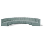 Meridian Furniture - Arc Vegan Leather Upholstered 8-Pc. Inward Curved Modular Sectional, Green - Unleash modern opulence with the Arc Vegan Leather 8pc. Sectional. Crafted for the modern connoisseur, this Sectional injects an air of refined luxury into any space. Its sleek silhouette, upholstered in supple mint green vegan leather, exudes timeless sophistication while the deep channel tufting adds textural intrigue, further elevating the chair's visual appeal. The modular design makes it a versatile chameleon, effortlessly adapting to your evolving needs and preferences. Whether you envision it gracing a chic living room corner, basking in the glow of a bedroom window, or adding a touch of drama to a home office, the Arc seamlessly complements your unique interior aesthetic.