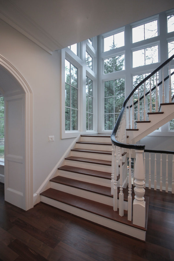 Powerful Impression by Floating Staircase in Suburban Foyer
