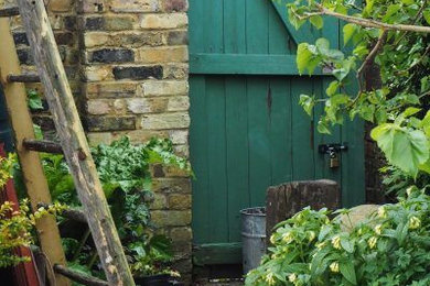 Inspiration for a mid-sized coastal backyard gravel landscaping in Seattle.