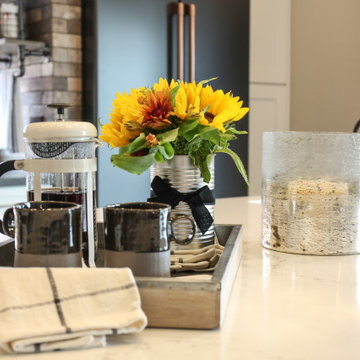 A mixture of quartz countertops separates the island from the workspaces