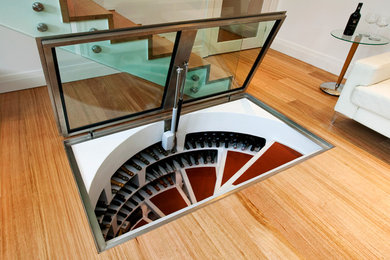 Photo of a small contemporary wine cellar in Sydney with display racks.