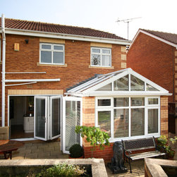 White Conservatory with PVCu Bi-Fold Doors - Products
