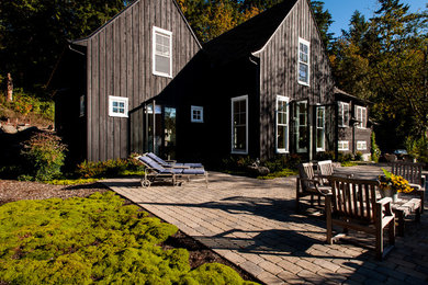 Inspiration for a mid-sized country brown two-story wood exterior home remodel in Seattle with a shingle roof