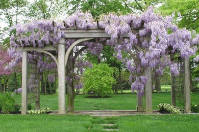 Design ideas for a large traditional partial sun backyard landscaping in Other.