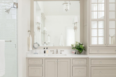 Large elegant master marble floor, beige floor, double-sink and vaulted ceiling bathroom photo in Chicago with beaded inset cabinets, beige cabinets, white walls, an undermount sink, quartz countertops, a hinged shower door, white countertops, a niche and a built-in vanity
