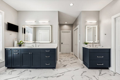 Large minimalist master blue tile and ceramic tile porcelain tile, blue floor and double-sink bathroom photo in Portland with shaker cabinets, blue cabinets, a bidet, gray walls, an undermount sink, quartz countertops, a hinged shower door, white countertops and a built-in vanity