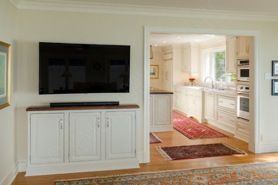 Inspiration for a large timeless galley medium tone wood floor and brown floor kitchen pantry remodel in Richmond with an undermount sink, beaded inset cabinets, white cabinets, quartz countertops, beige backsplash, paneled appliances, an island and white countertops