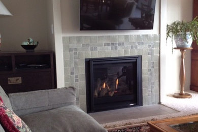 Family room - transitional family room idea in Seattle with a tile fireplace