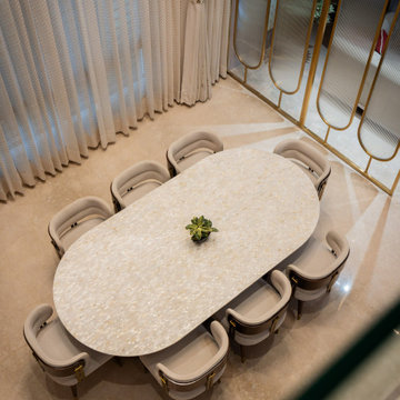 Bespoke Mother of Pearl Dining Table with Brass-Accented Chairs | Sobha Internat