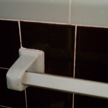 minor remodel of 1950s mint green and black bath