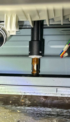 LG 3900 front loader leaking underneath.