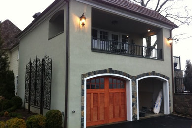 Example of a large classic attached two-car garage design in New York