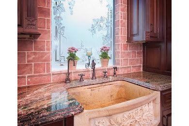 Example of a tuscan kitchen design in Seattle